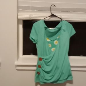 Large shirt that forms to the body. Green and yellow on color.